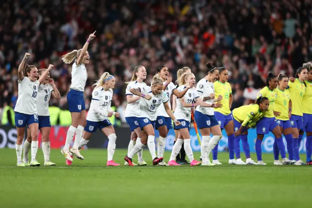 England celebrate scoring a penalty against Brazil.