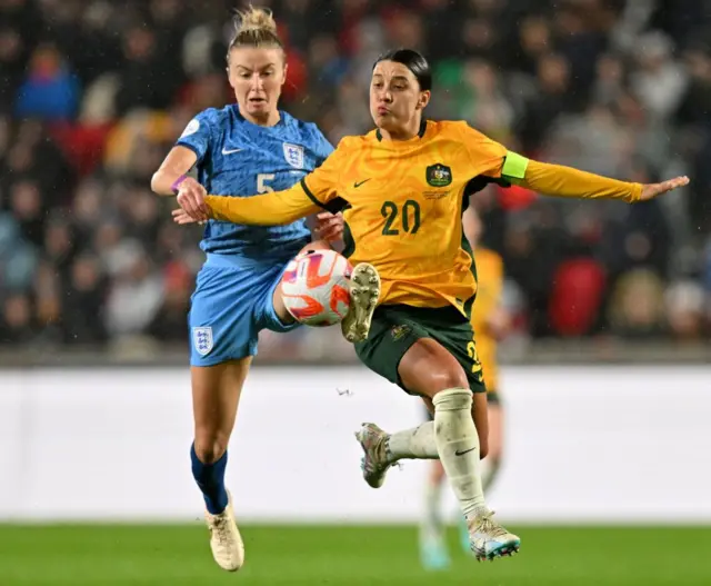 Leah Williamson battles for the ball with Sam Kerr.