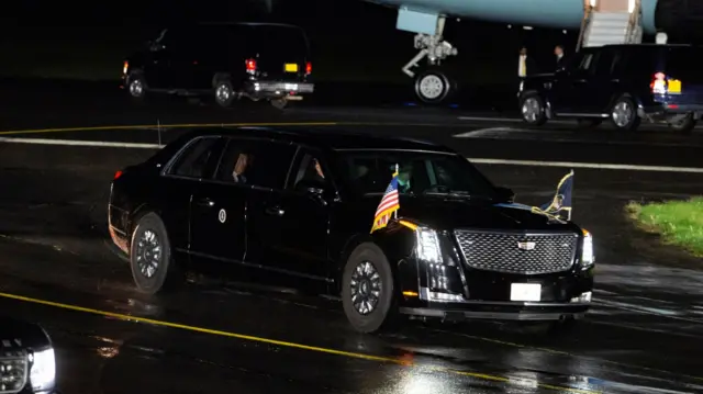 Biden is driven away from Air Force One after landing in Northern Ireland last night