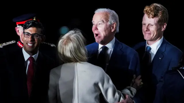 British Prime Minister Rishi Sunak and U.S. Ambassador to the United Kingdom Jane Hartley greet U.S. President Joe Biden next to Joe Kennedy upon Biden's arrival at RAF Aldergrove airbase in County Antrim, Northern Ireland April 11, 2023.