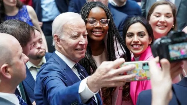 Biden poses for selfies