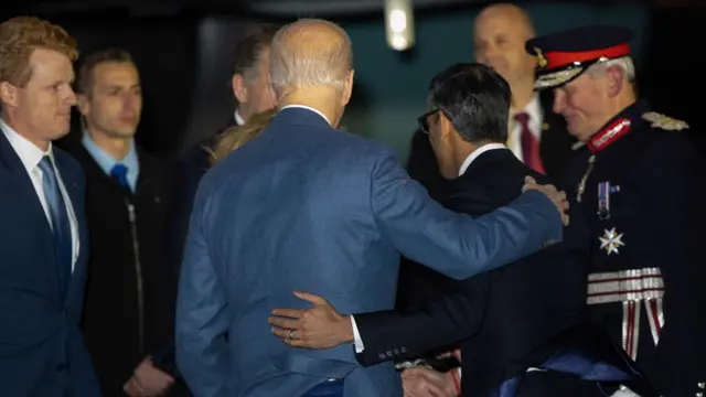 Joe Biden was greeted by Prime Minister Rishi Sunak as he stepped off of Air Force One in Belfast on Tuesday night