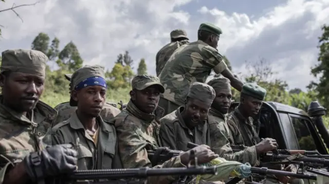 M23 rebels pictured on the back of a truck in DR Congo in January 2023