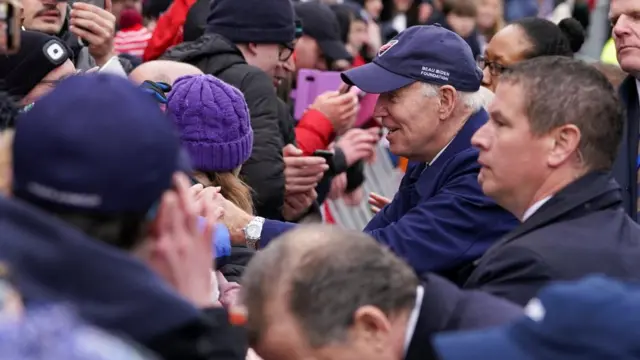 President Joe Biden shakes hands with people in Dundalk