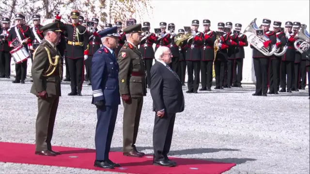 Irish President Michael D Higgins waits for Joe Biden