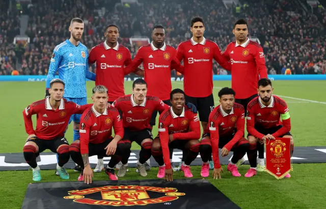 Manchester United players pose for a team group photo before the match