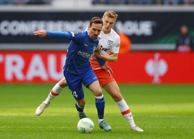 KAA Gent's Sven Kums in action with West Ham United's Flynn Downes