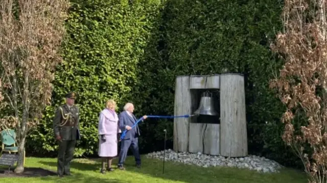 Michael D Higgins ringing the Peace Bell with his wife Sabina