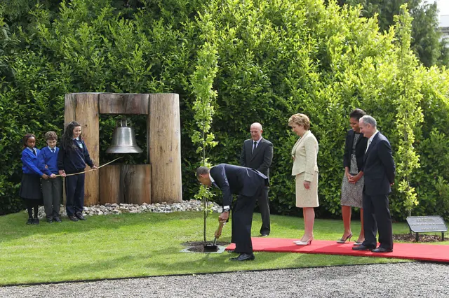 U.S. President Barack Obama plants a tree at Aras an Uachtarain May 23, 2011 in Dublin, Ireland.