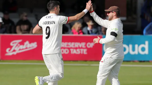 James Anderson celebrates taking a wicket