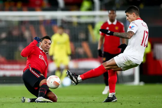 Manchester United's Casemiro (L) in action against Sevilla's Erik Lamela (R) during the UEFA Europa League quarter final first leg soccer match between Manchester United and Sevilla