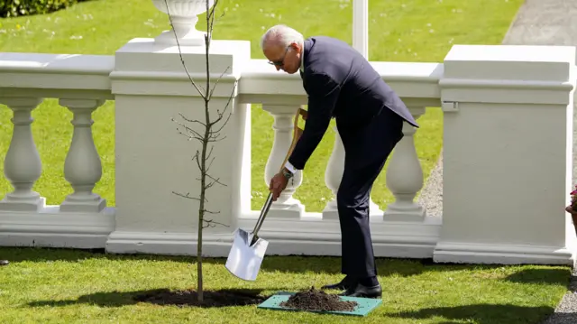 US President Joe Biden planting a tree