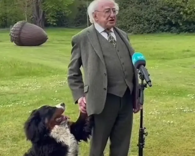 Michael D Higgins holds hands with his dog Misneach