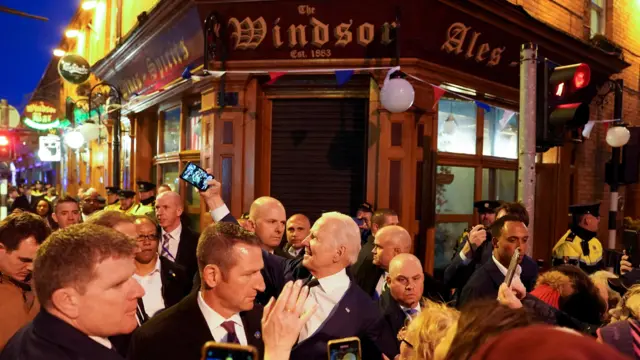 Biden takes a selfie outside a pub during his visit to Dundalk, Ireland