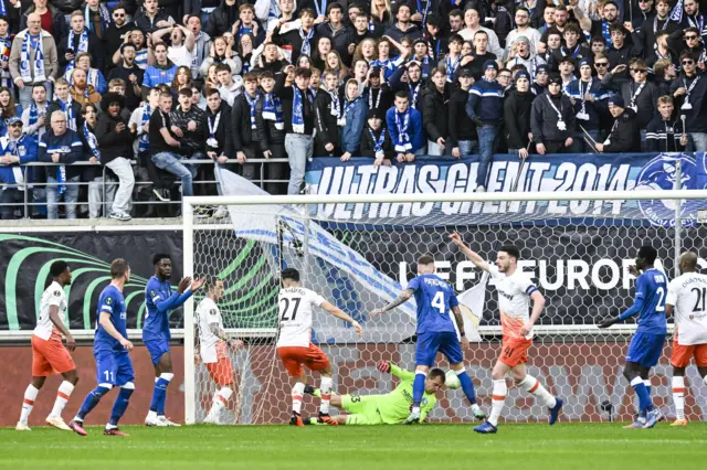 West Ham's Nayef Aguerd and Gent's goalkeeper Davy Roef pictured in action during a soccer game between Belgian KAA Gent and English West Ham United FC, a first leg game of the quarterfinals of the UEFA Europa Conference League