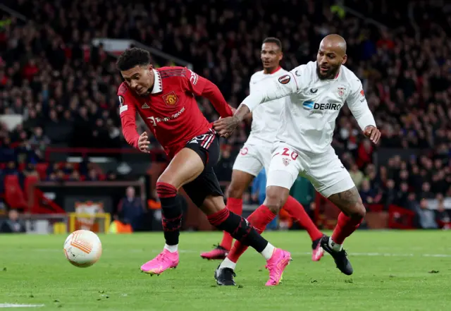 Manchester United's Jadon Sancho in action with Sevilla's Marcao