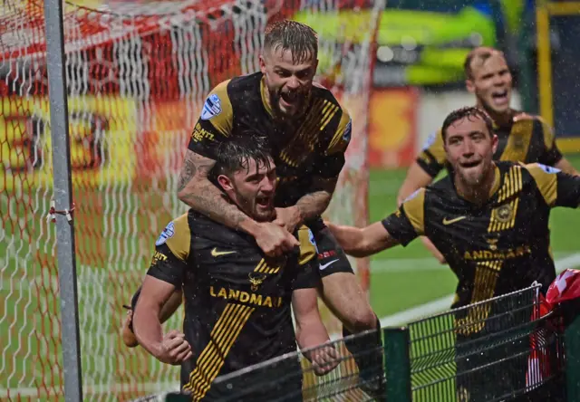 Lee Bonis celebrates his opening goal for Larne against Cliftonville