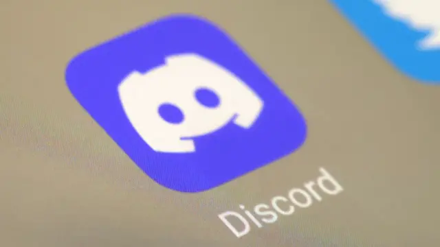 Discord app logo photographed on a secreen