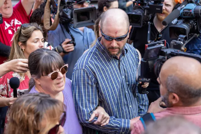 A couple believed to be Dawn and Thomas Dufault outside court in Boston