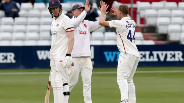 Jamie Porter celebrates taking wicket