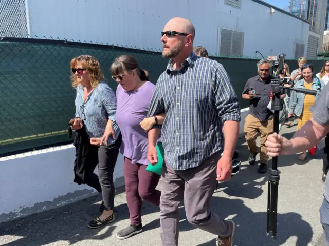 A couple believed to be Dawn and Thomas Dufault outside court in Boston