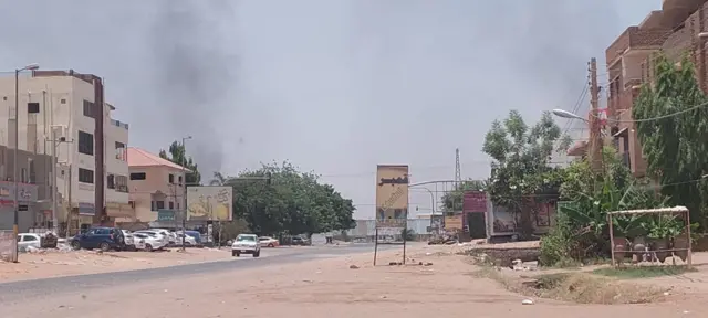 Smoke rises after clashes erupted in the Sudanese capital on 15 April 2023 between the Sudanese Armed Forces and the paramilitary Rapid Support Forces (RSF)