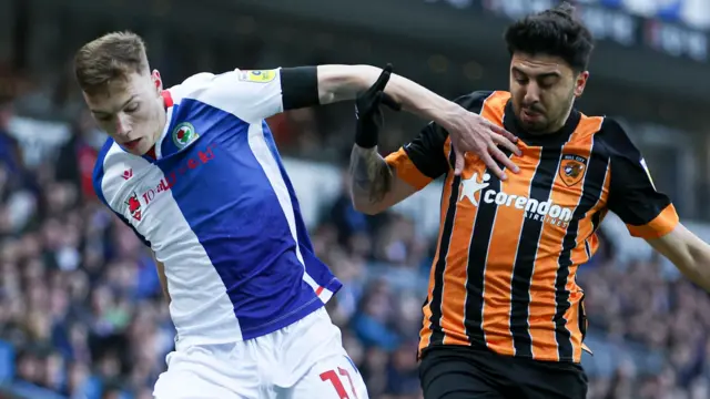 Hayden Carter and Ozan Tufan battle for the ball as Blackburn take on Hull