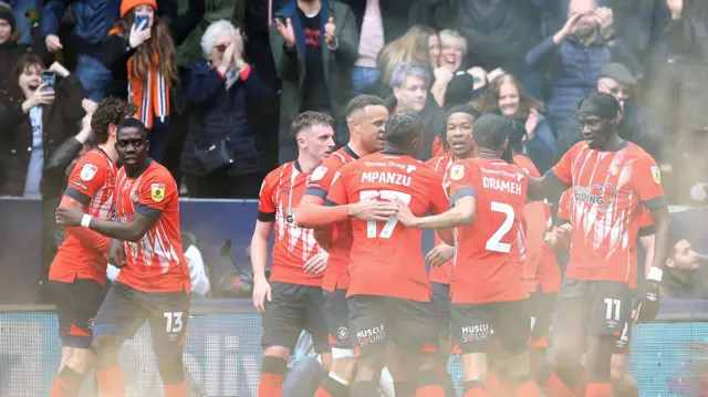 Luton celebrating a goal against local rivals Watford