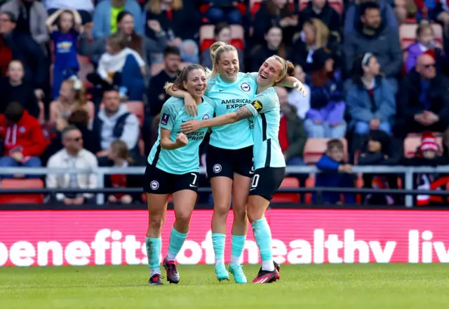 Brighton players celebrate after scoring