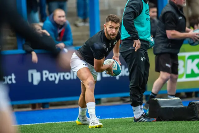 Rhys Webb warms up