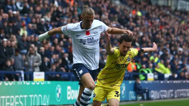 Preston's Brad Potts battling with Millwall player George Saville