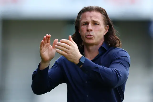 QPR manager Gareth Ainsworth clapping his supporters