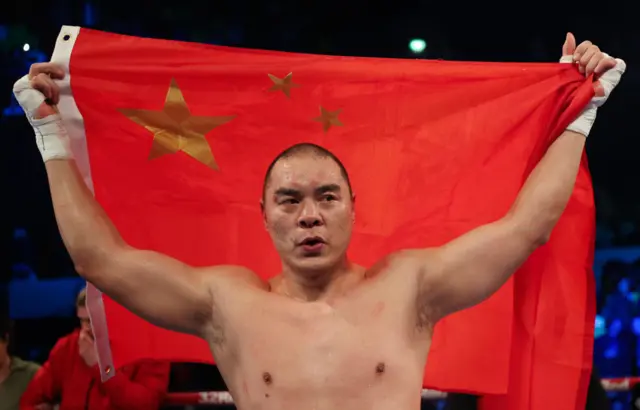 Zhilei Zhang with the Chinese flag