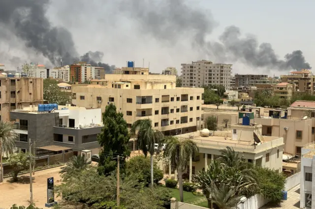 Smoke rises over Khartoum on Sunday