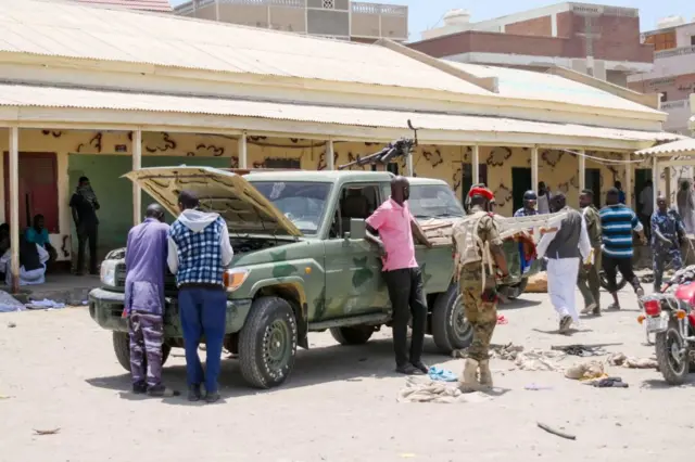 Soldiers, loyal to army chief Abdel Fattah al-Burhan, inspect their vehicle in the Red Sea city of Port Sudan on 16 April 2023