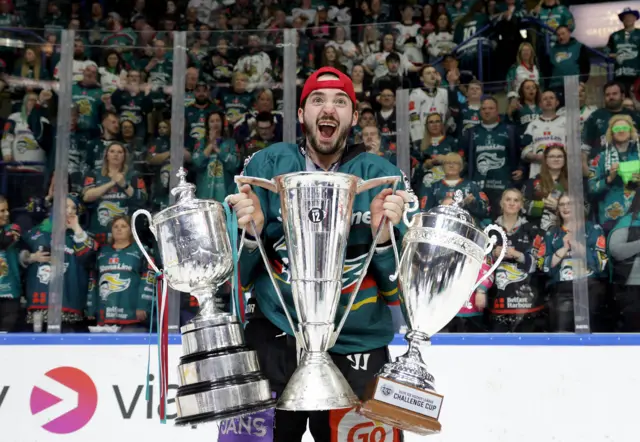 Belfast Giants Jeff Baum celebrates the 'treble' after being crowned Elite Ice Hockey League Champions, Challenge Cup Champions and the EIHL Playoffs Champions