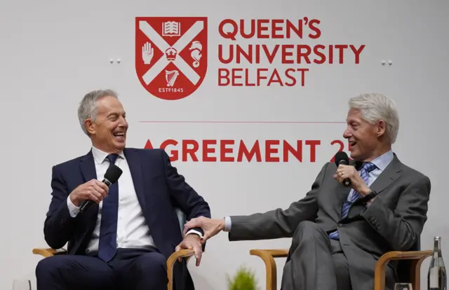 Tony Blair and Bill Clinton share a joke