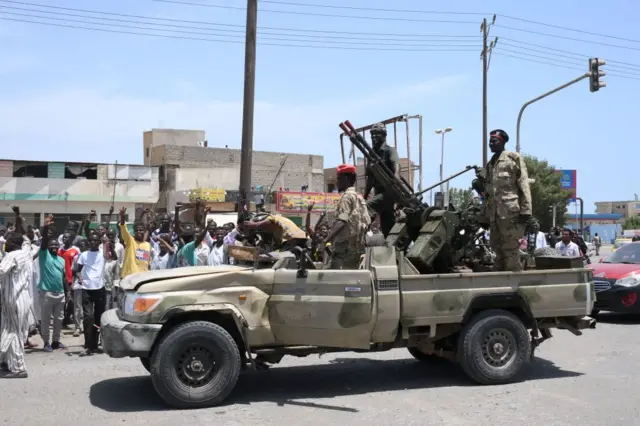 Sudanese greet army soldiers