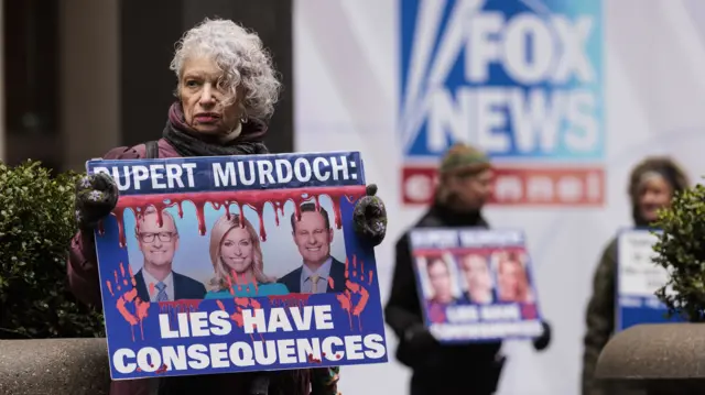 Anti-Fox News protestor outside the broadcaster's HQ in New York