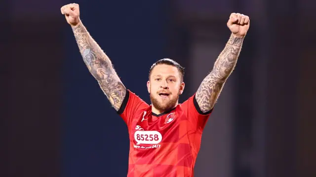 George Moncur celebrates Leyton orient winning promotion to League One