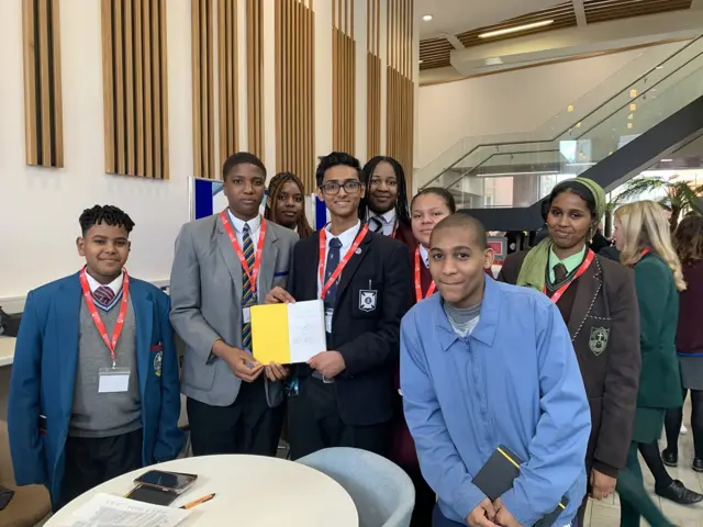 Students representing Diverse Youth NI who had their notebook signed by Sir Tony Blair