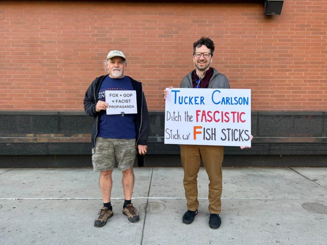 Two anti-Fox News protestors outside the courthouse