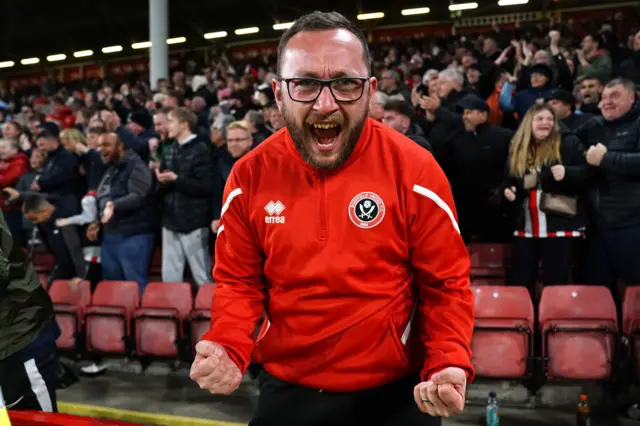 A Sheffield United fan celebrates their win over Bristol City