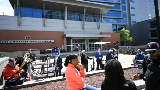 A general view shows as media members stand outside the Leonard L Williams Justice Center