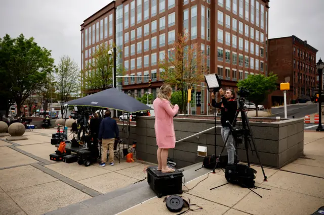 Journalists set up in the plaza outside the justice centre on Monday in Wilmington, Delaware