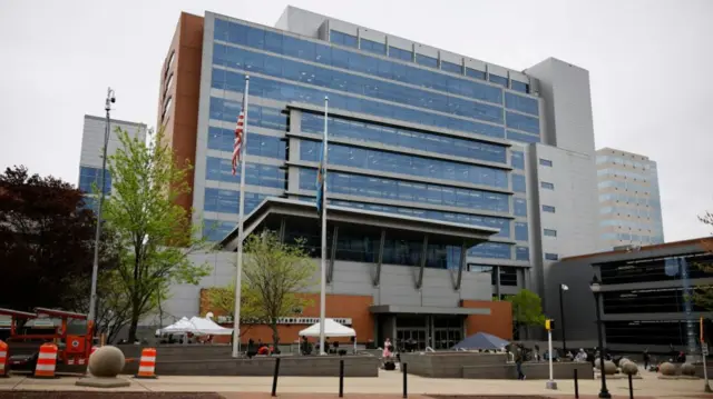 Journalists set up in the plaza in front of the Leonard Williams Justice Center