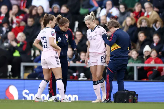 Leah Williamson limps off the field.