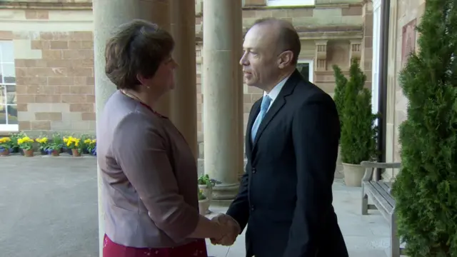 Dame Arlene Foster shakes hands with NI Secretary's Chris Heaton-Harris