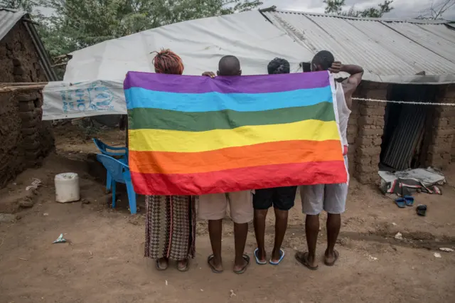 Ugandan LGBT refugees pose in a protected section of Kakuma