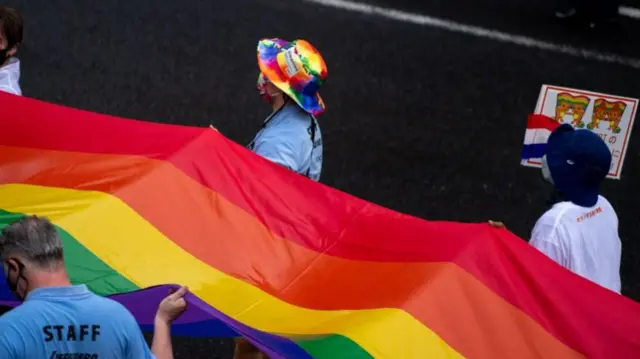 People attend the Tokyo Rainbow Pride 2022 Parade in Tokyo on April 24, 2022, to show support for members of the LGBT community